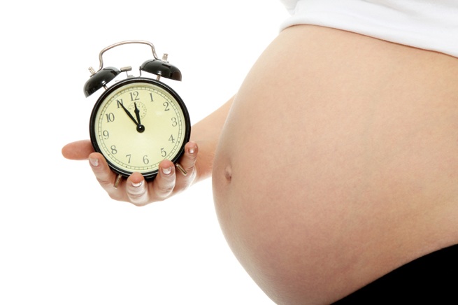 Pregnant woman w/ clock